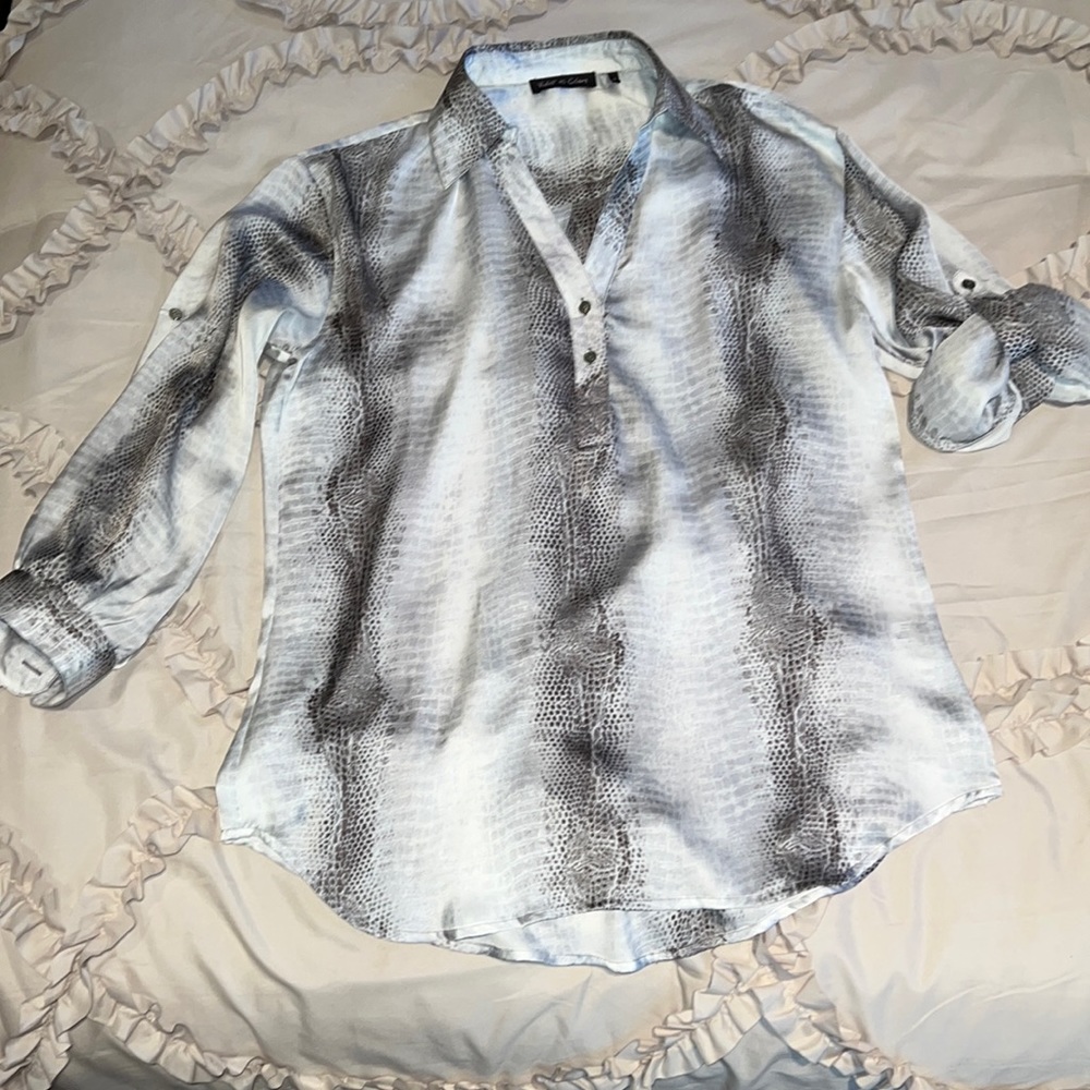 Snake skin looking material with long sleeves that can be cuffed with buttons